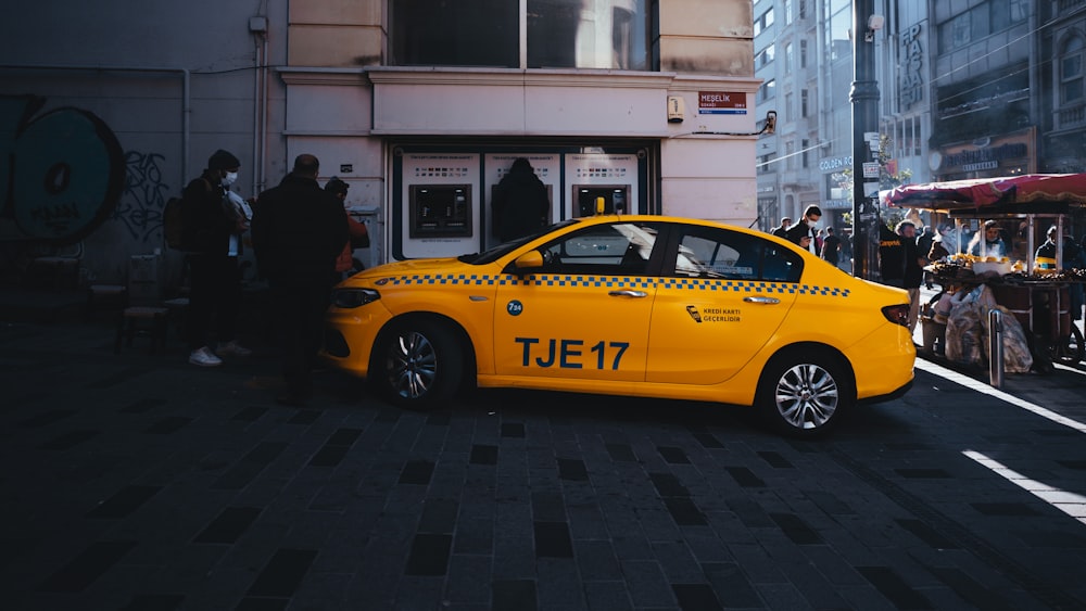 yellow taxi cab on street