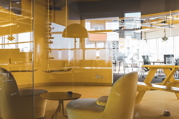 A stylish office space with contemporary furniture and bright lighting.