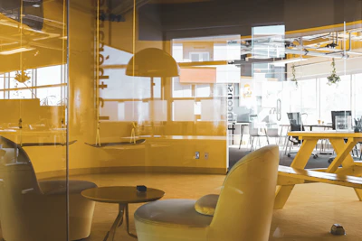 Modern office space of a.a. garelli y cia with warm yellow and black branding accents.