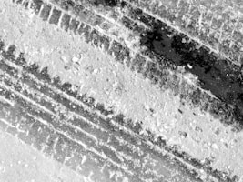 grayscale photo of concrete road