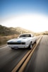 white audi coupe on road during daytime