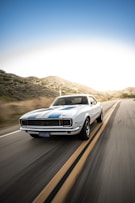 white audi coupe on road during daytime