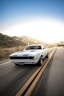 white audi coupe on road during daytime