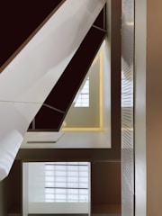 Modern architectural blueprint with warm lighting highlighting clean lines and details.