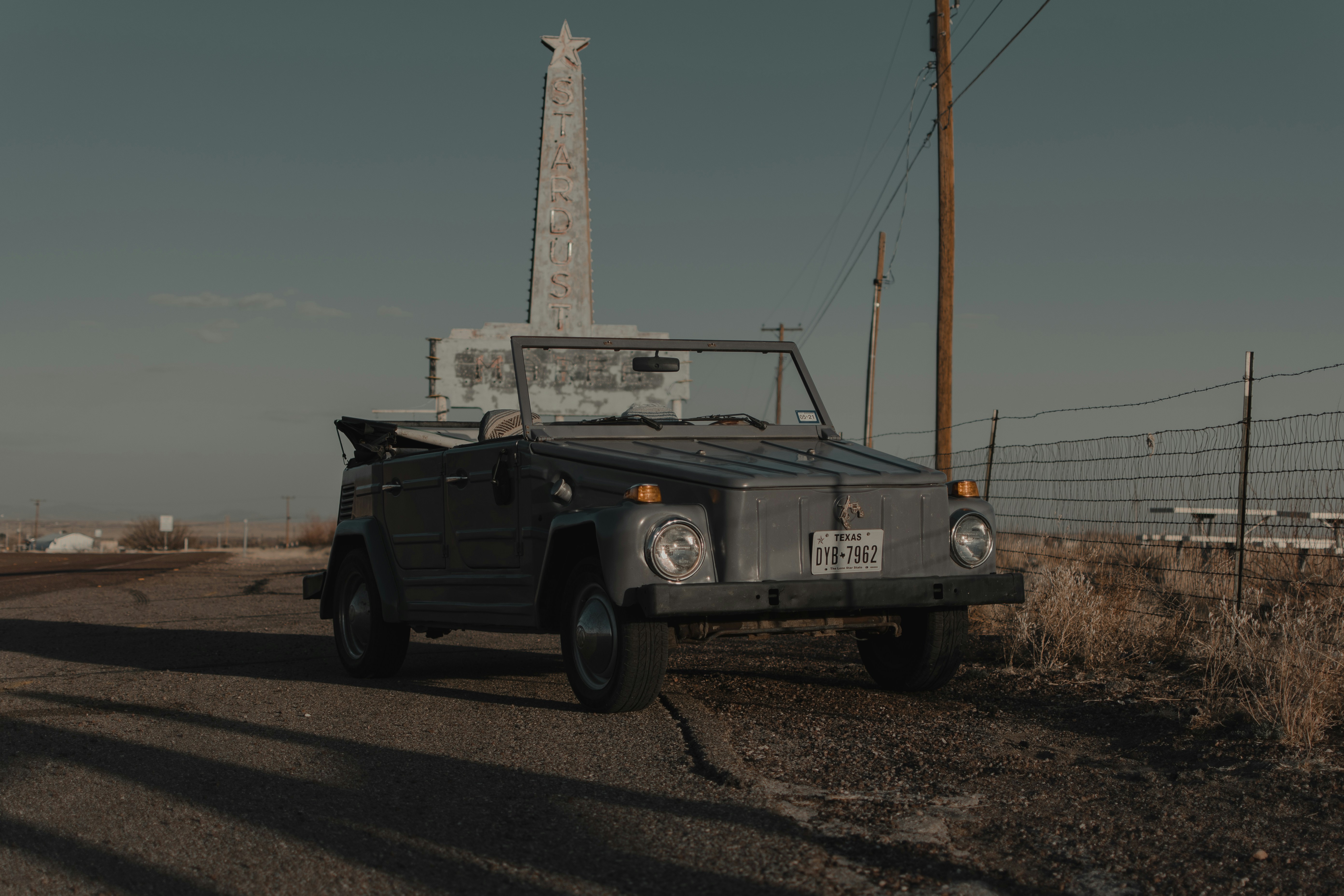white single cab pickup truck on road during daytime