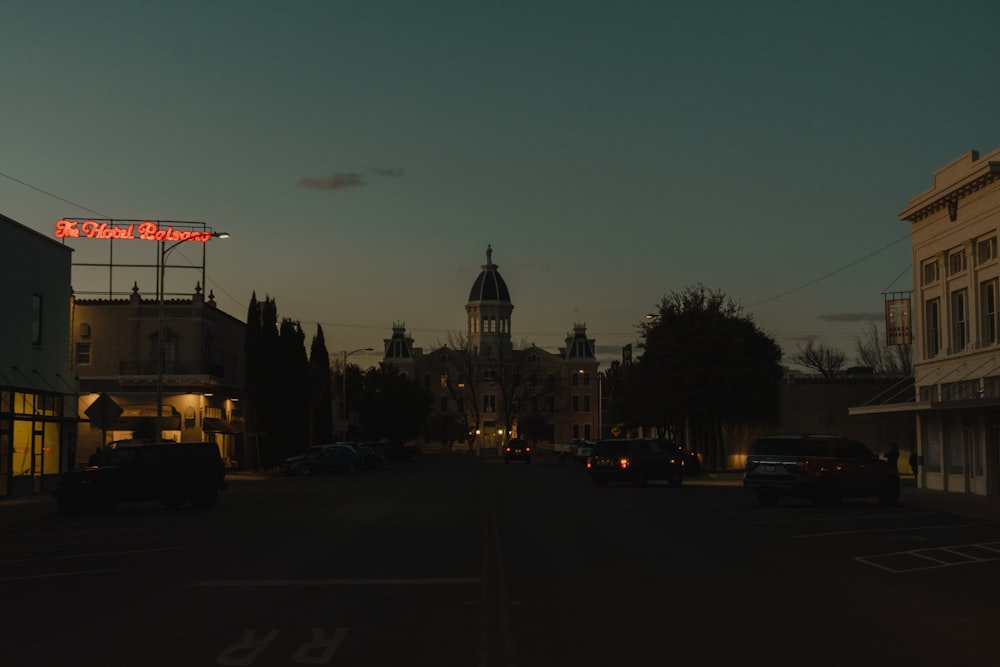 cars on road near building during night time