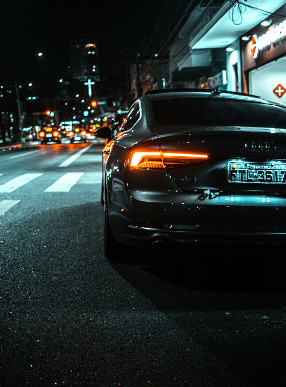 black honda car on road during night time
