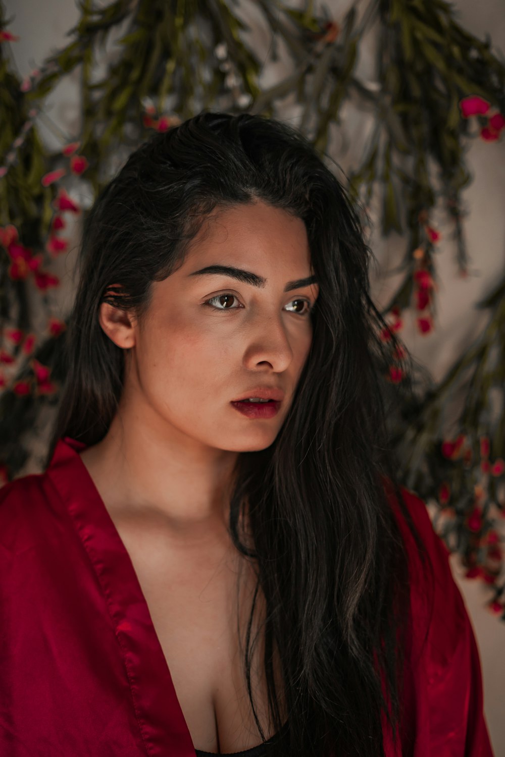 woman in red shirt with black hair