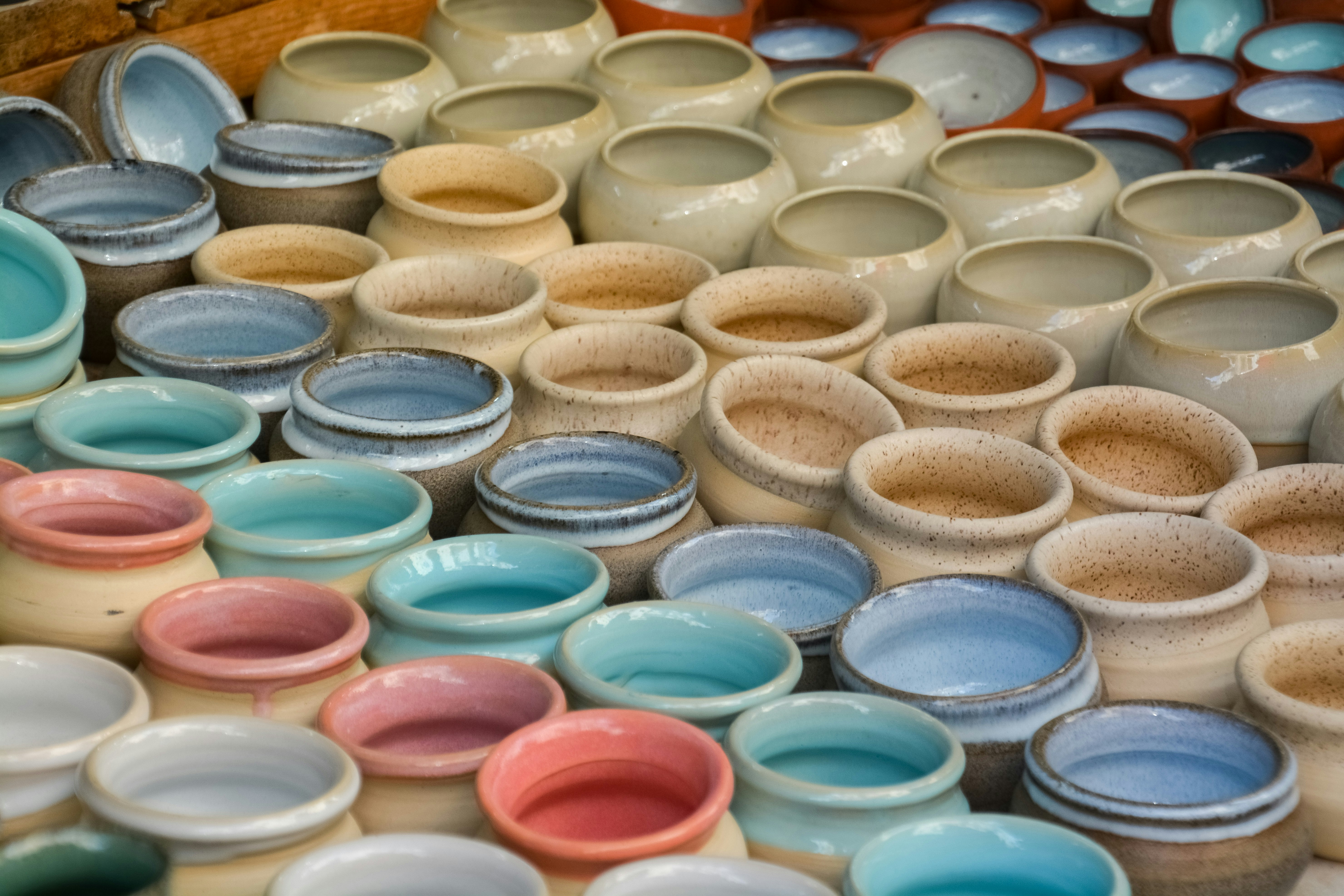 white blue and pink ceramic bowls