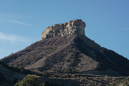 brown rock formation under blue sky during daytime