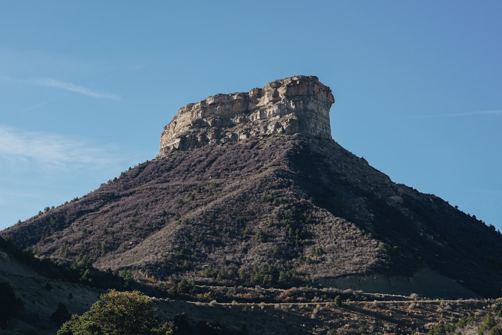 brown rock formation under blue sky during daytime