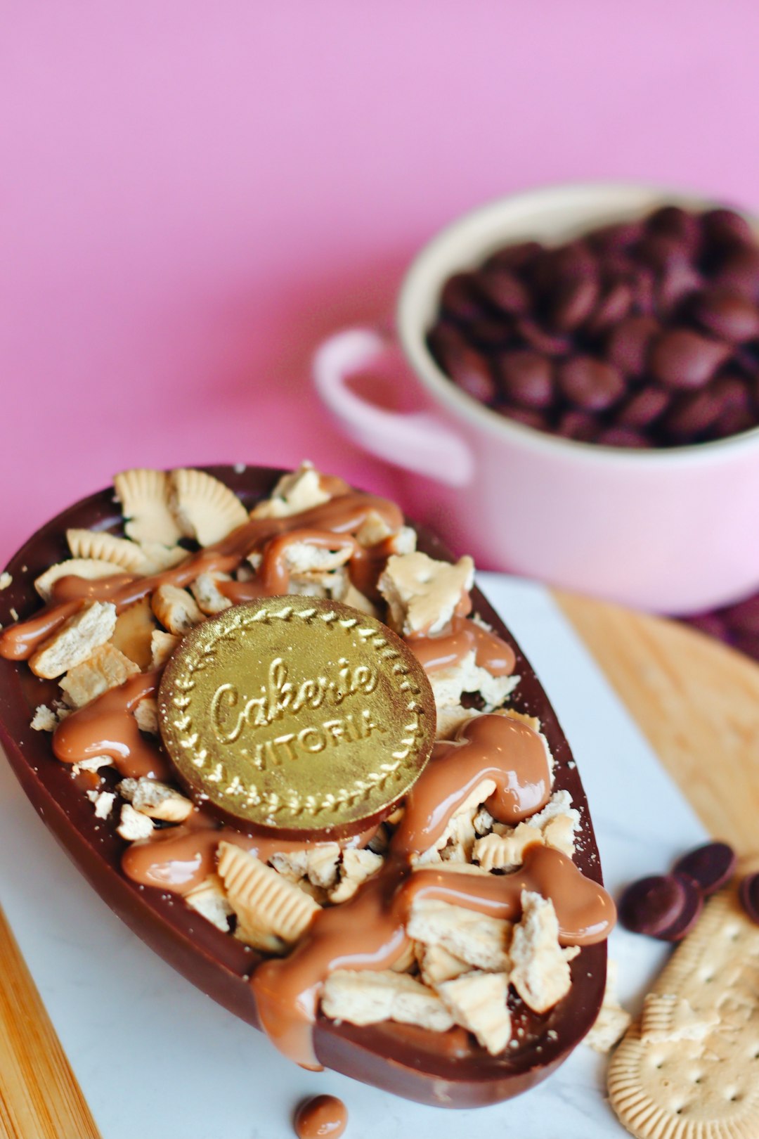 chocolate and peanut on pink ceramic bowl