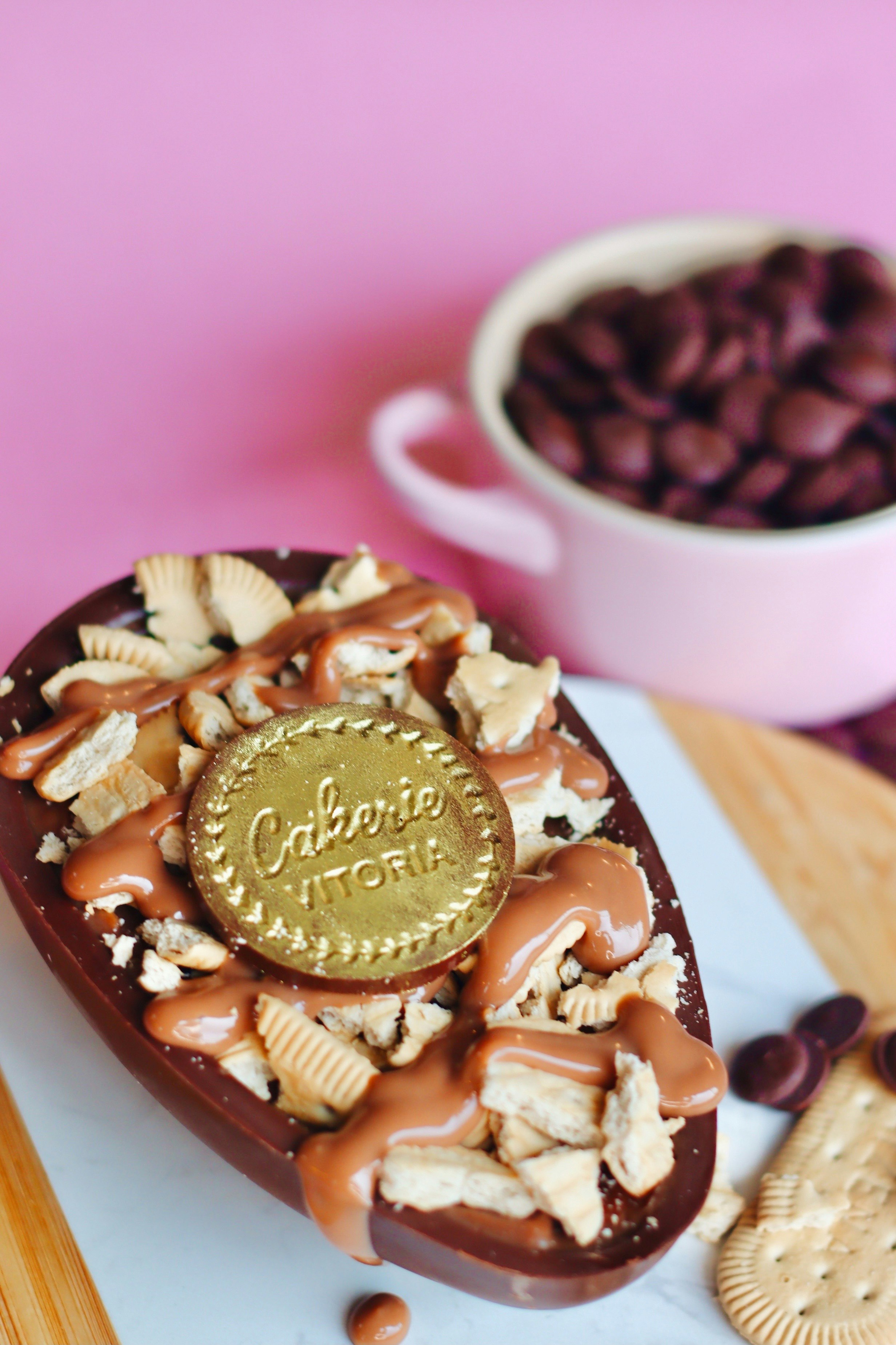 chocolate and peanut on pink ceramic bowl