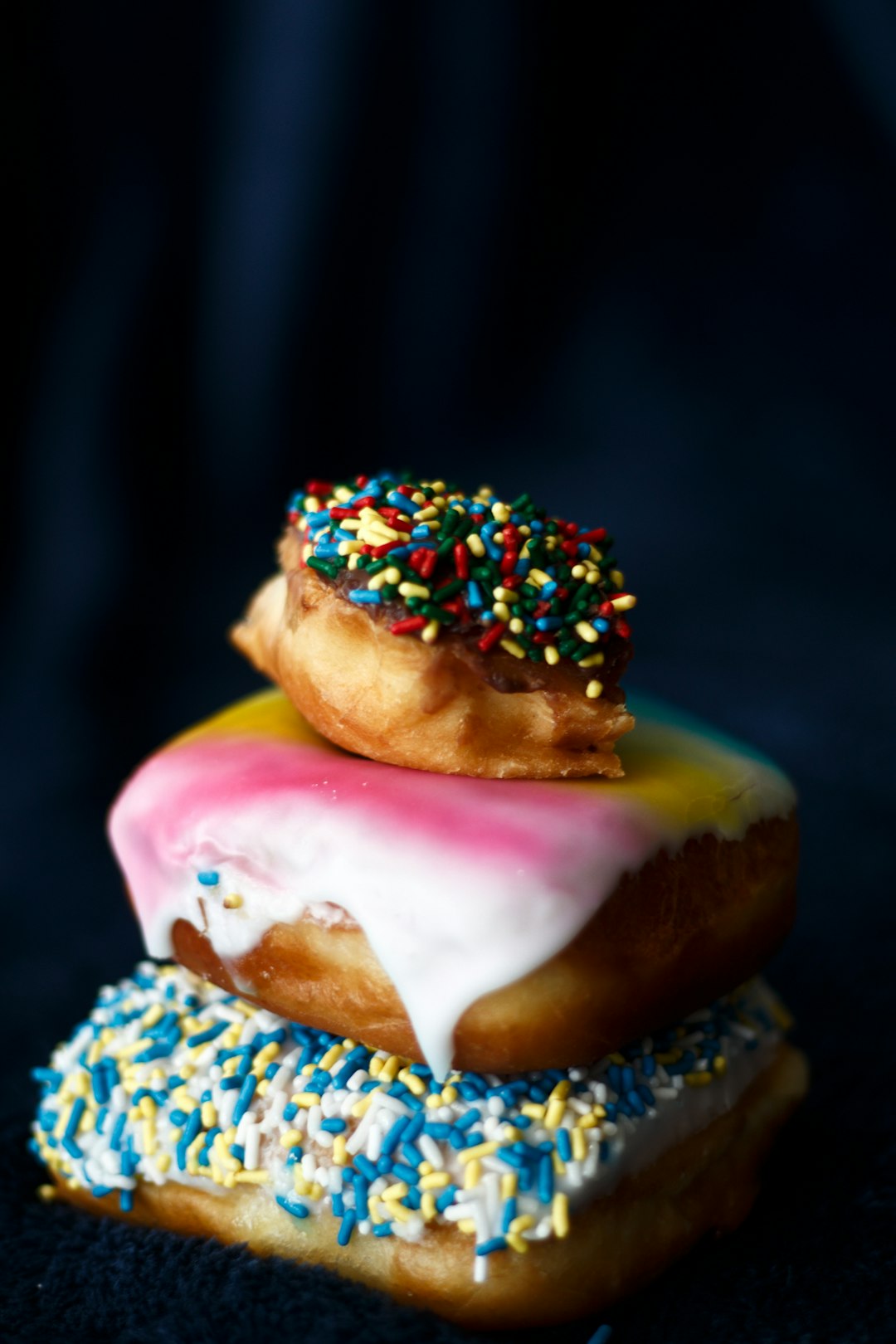 brown and white doughnut with sprinkles