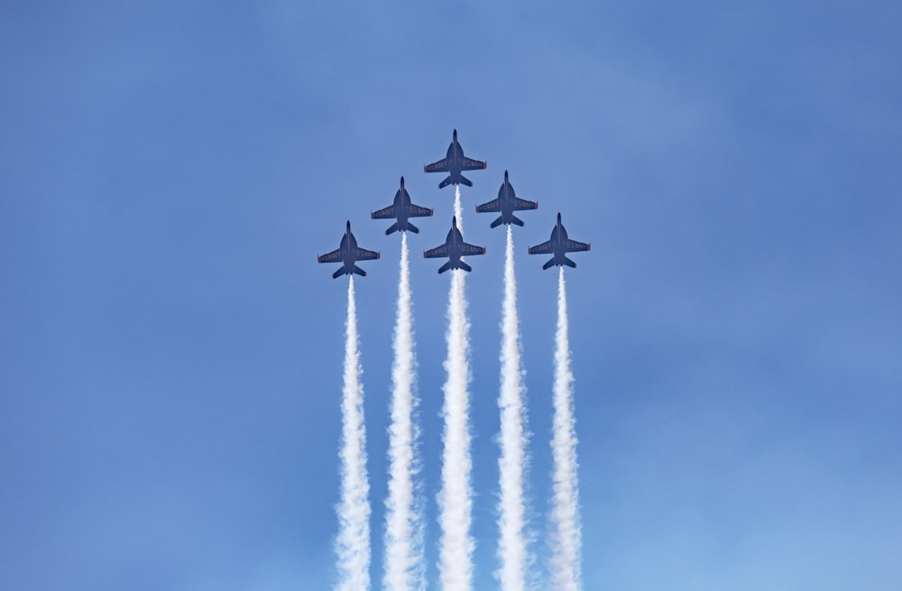 four jet planes in mid air
