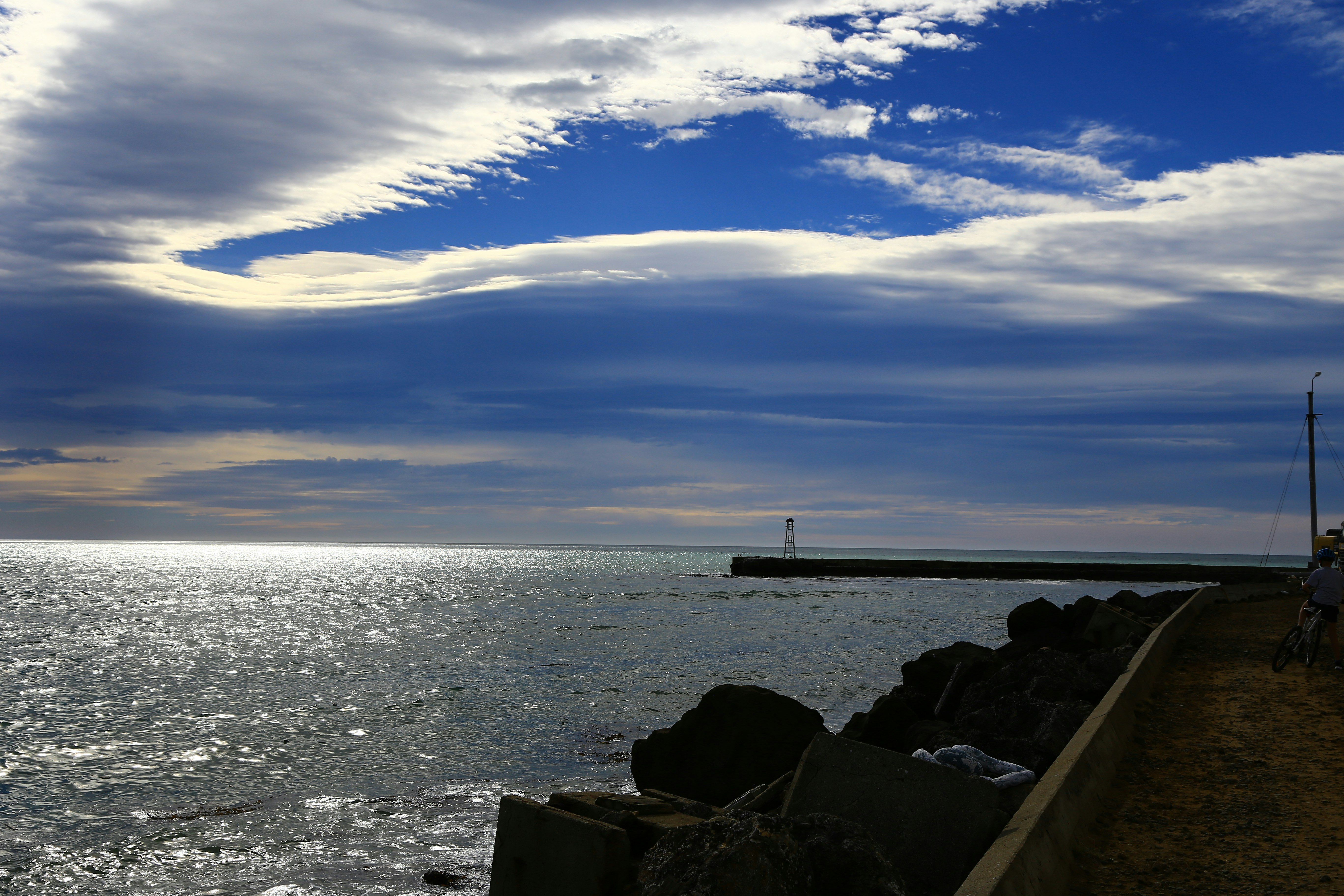 white and black ship on sea under blue sky during daytime