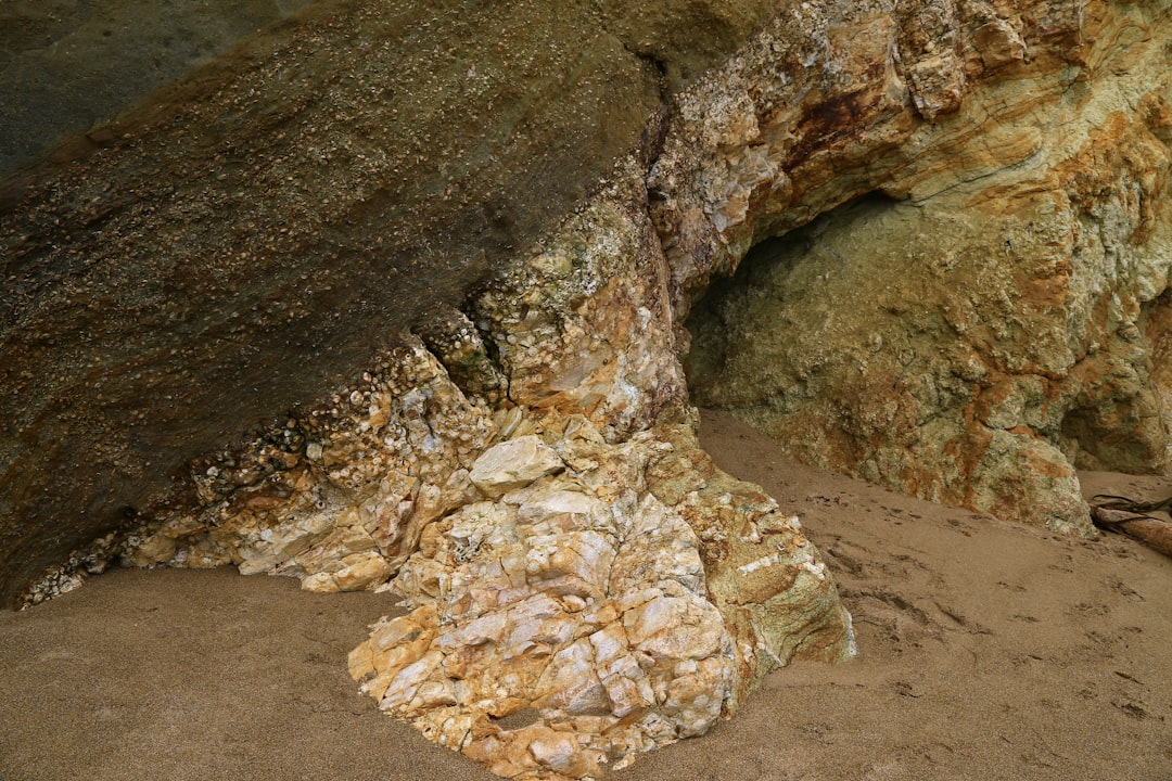 brown and gray rock on brown sand