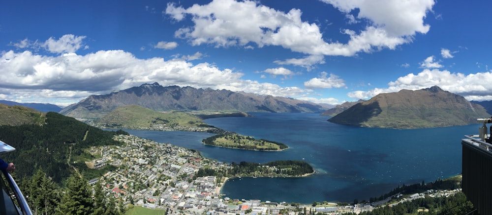 aerial view of green mountains and body of water during daytime