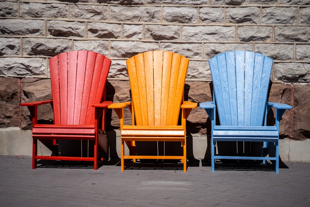 red and blue wooden armchairs