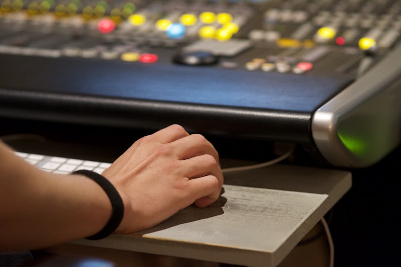 Producer working at mixing console for hip-hop beat mixing and mastering