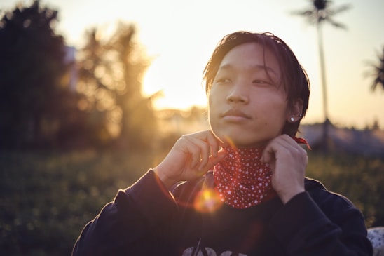 A serene image of a person wearing the posture-correcting device while walking outdoors in soft morning light.