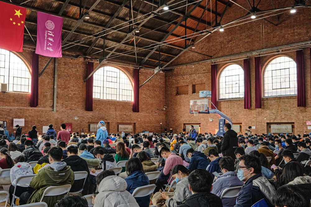 people sitting on chair inside building