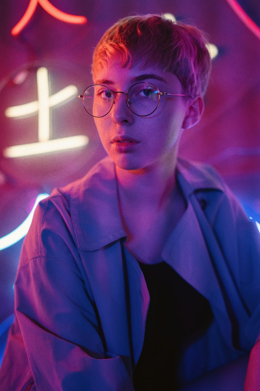 man in black framed eyeglasses and blue button up shirt