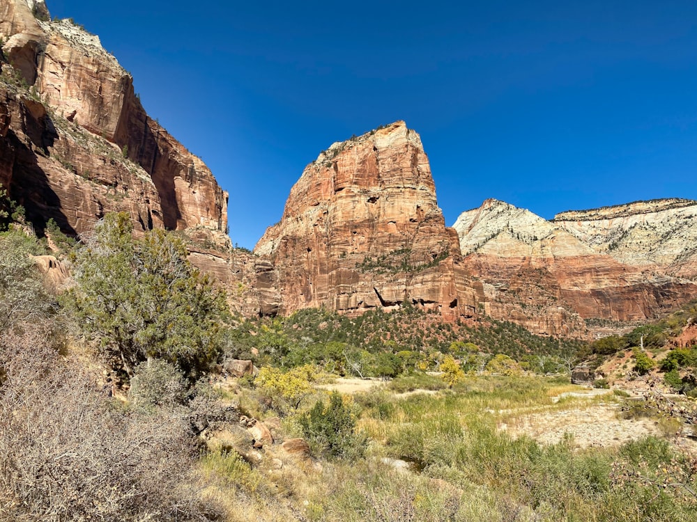 brown rocky mountain under blue sky during daytime