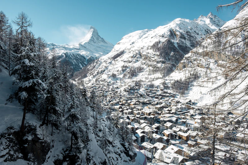 The town of Zermatt below the Matterhorn under a clear winter sky