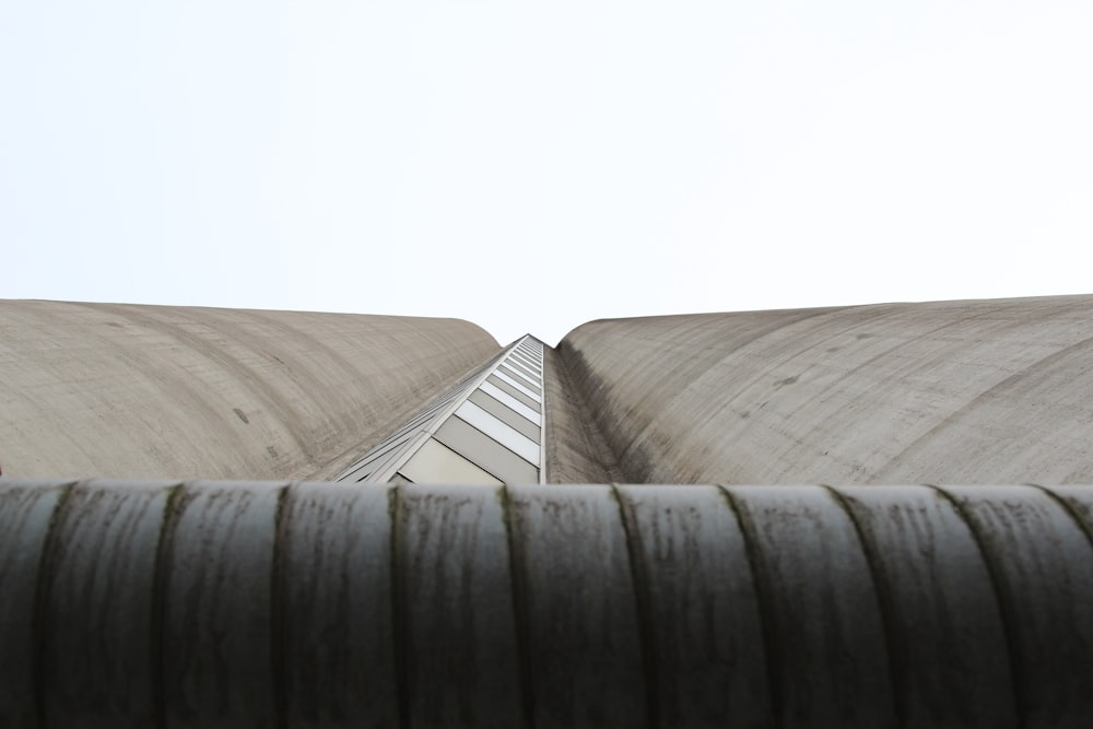 low angle photography of gray concrete building