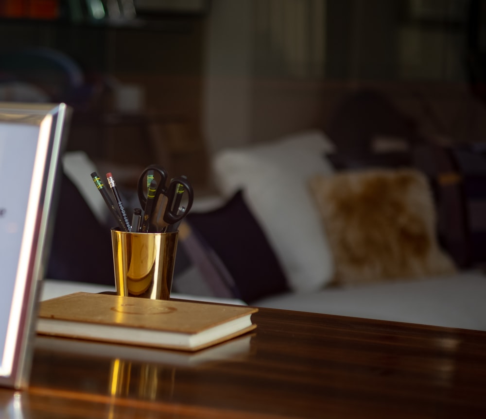 gold trophy on brown wooden table