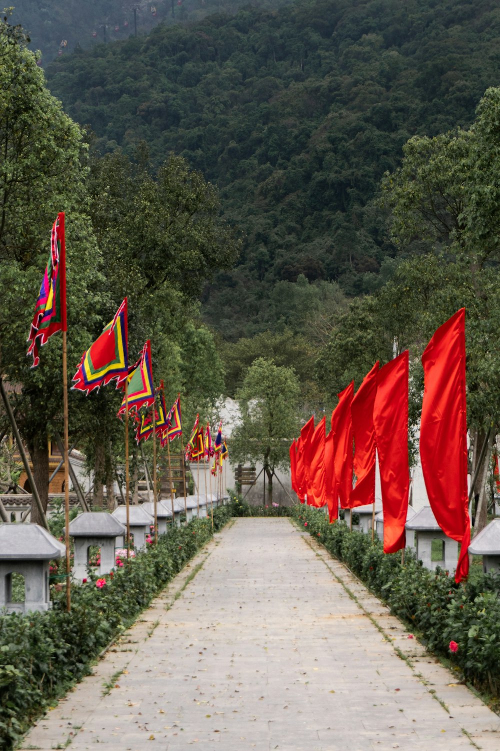 red and green flags on gray concrete pathway