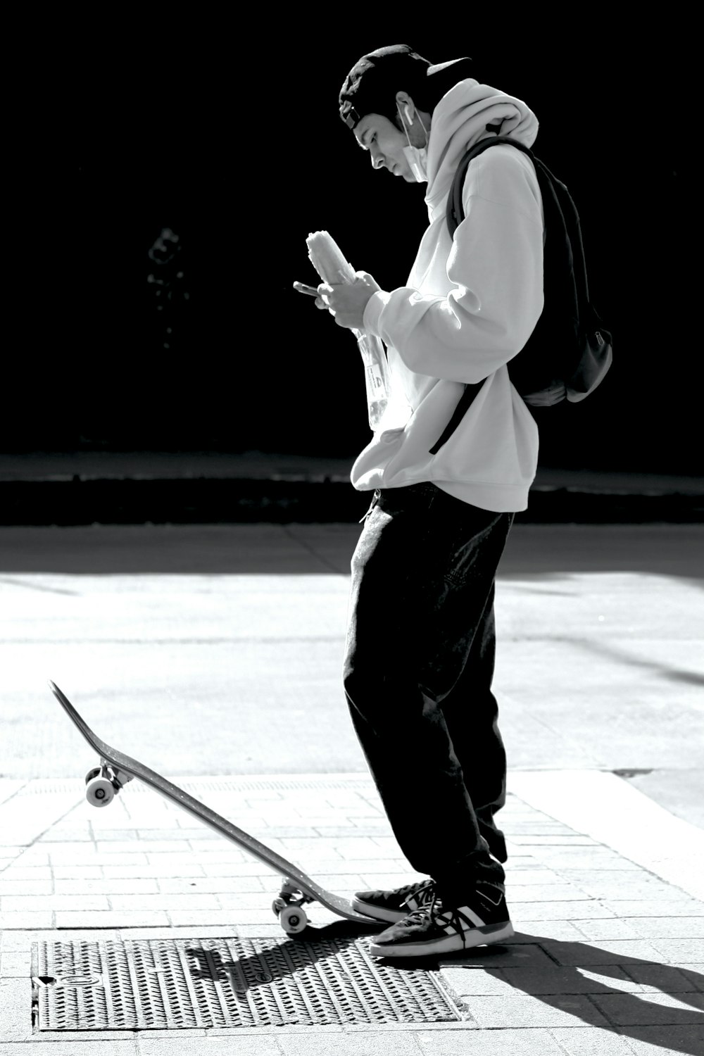 man in white dress shirt and black pants standing on white floor