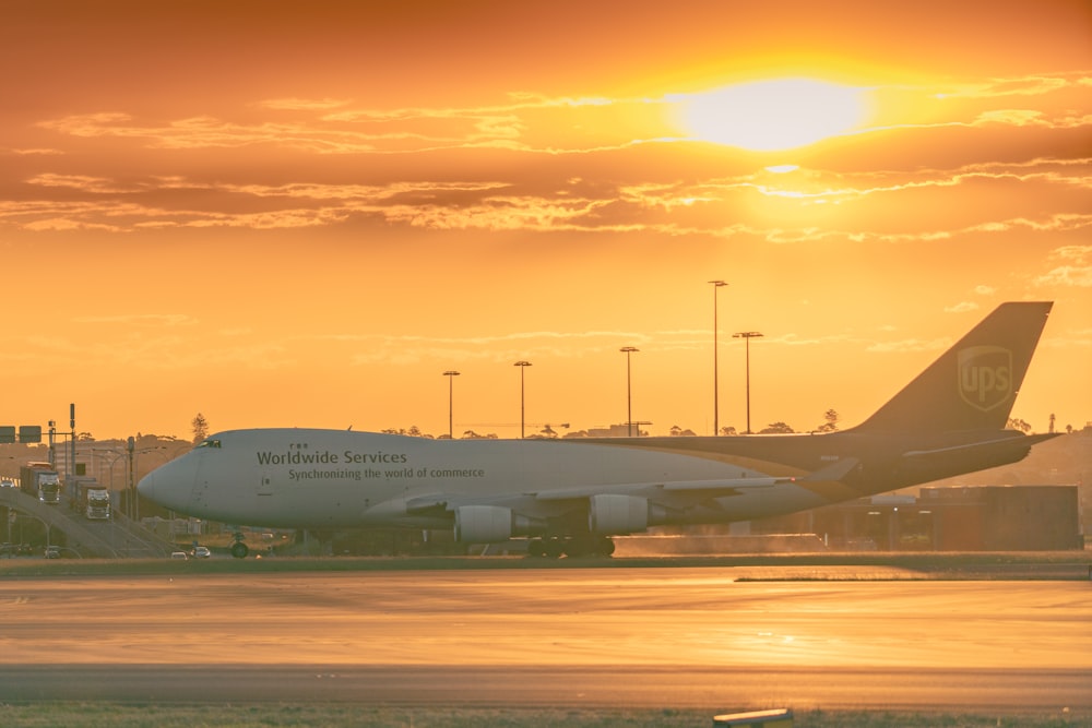 white passenger plane on airport during daytime