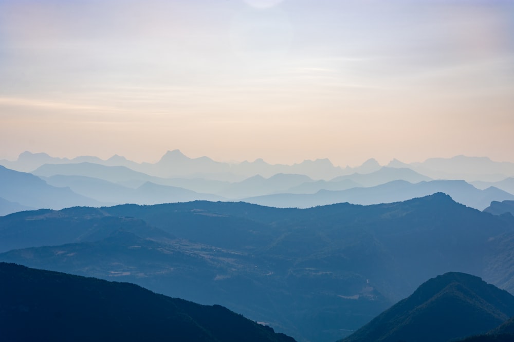 mountains under white clouds during daytime