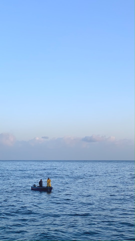 person in black shirt standing on sea during daytime in Beirut Lebanon