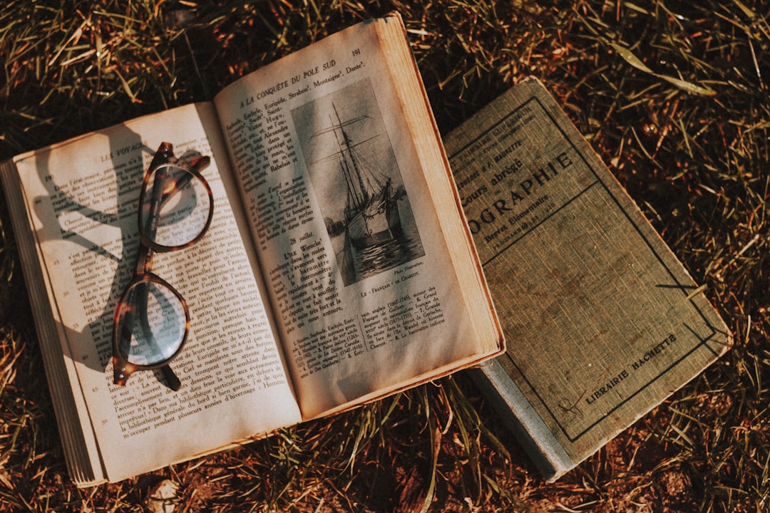 black framed eyeglasses on book page