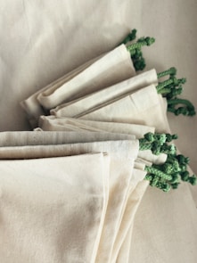 white and green floral textile