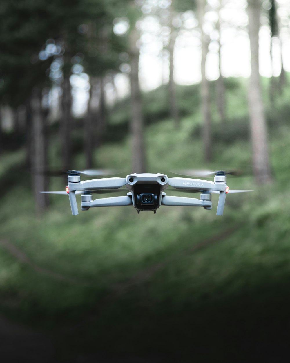 gray and black drone in mid air during daytime