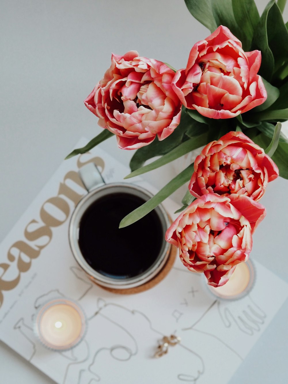 red roses on white and brown heart print table