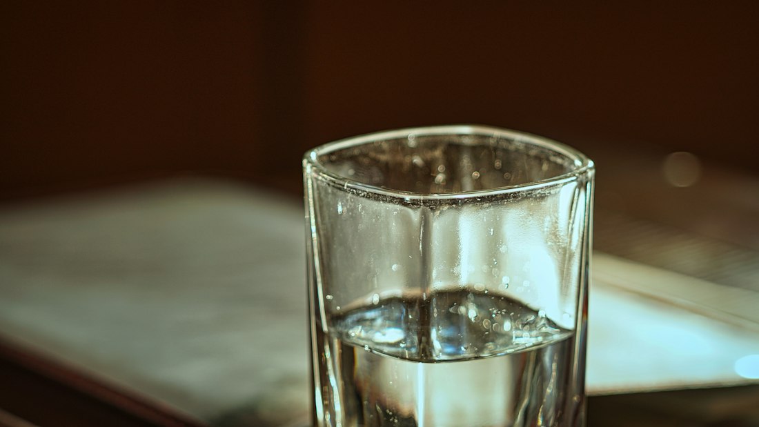 A clear glass of water on a table
