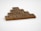 Wooden Scrabble tiles are arranged to spell the word 'FOUNDATION' in a pyramid shape on a plain white background.