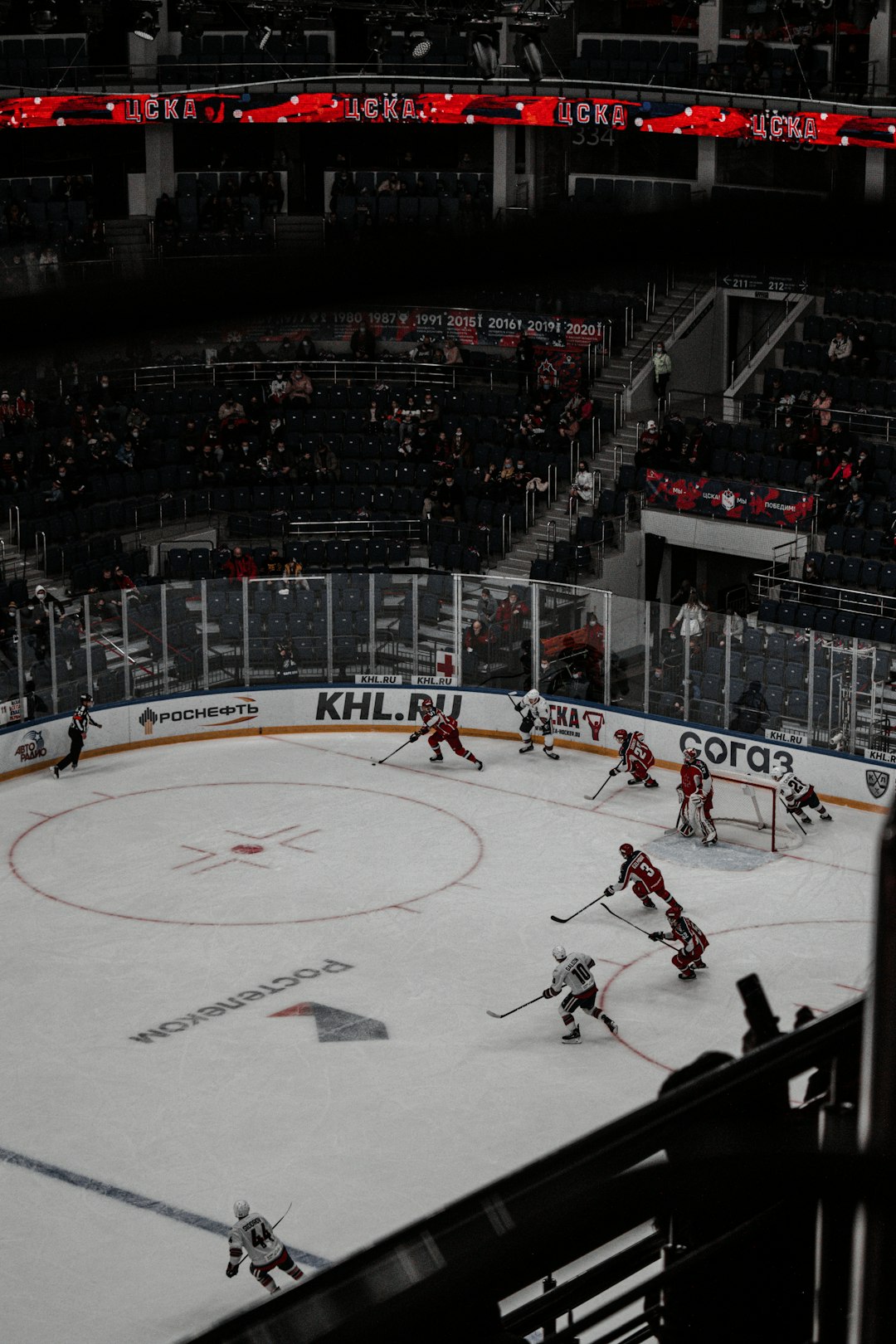 people playing ice hockey on ice stadium