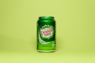 green and white labeled can
