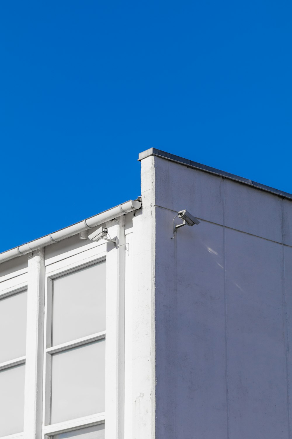 white concrete building under blue sky during daytime