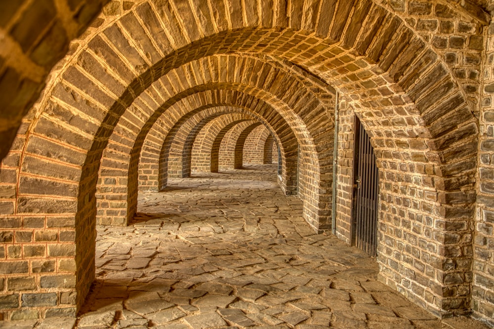 brown and beige concrete tunnel