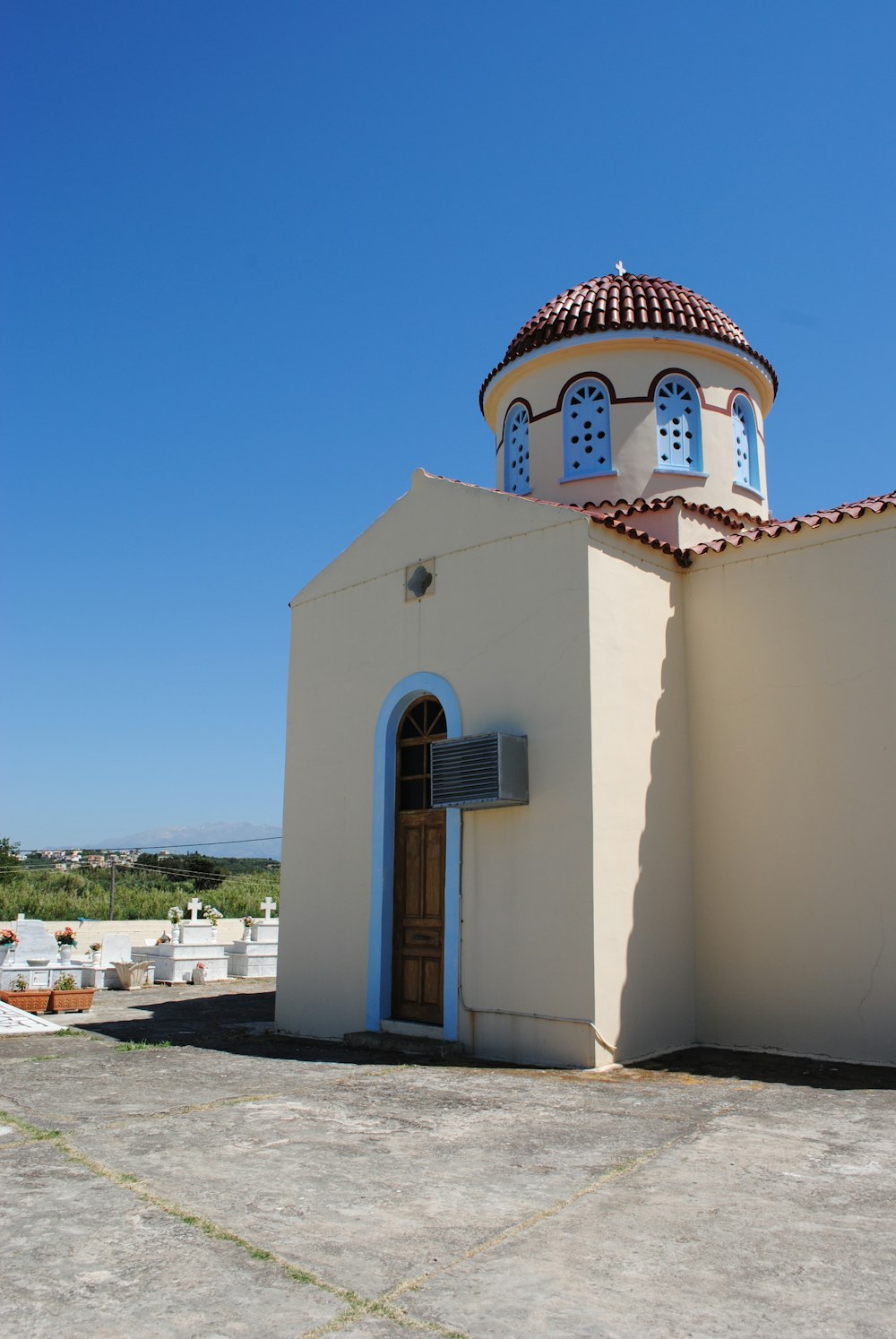 white and brown concrete building under blue sky during daytime