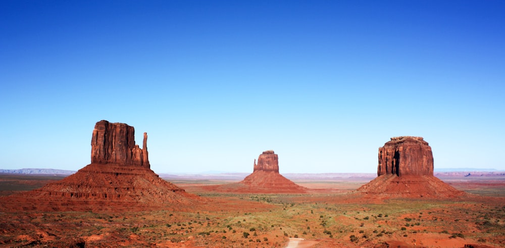 brown rock formation under blue sky during daytime