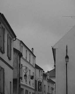 Photograph of a quiet Portuguese village street, evoking the atmosphere from the books