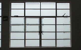Close-up of a double rail window sliding smoothly with clear measurement markings.
